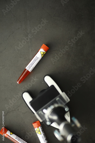 A blood sample for testing the dangerous virus coronavirus in the body. Test tubes with tests for coronavirus. Laboratory studies of viral diseases.