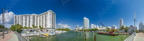 MIAMI BEACH, FL - FEBRUARY 26, 2016: Panoramic view of city river, bridge and buildings on a winter sunny day