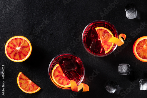 Negroni cocktails with blood oranges and ice, shot from above photo