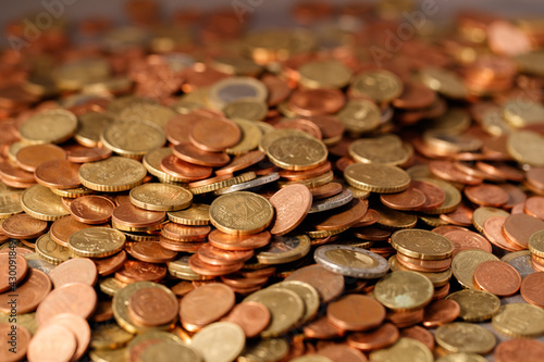 Series of macro shots of euro coins. Heap of different coins as a background with selective focus