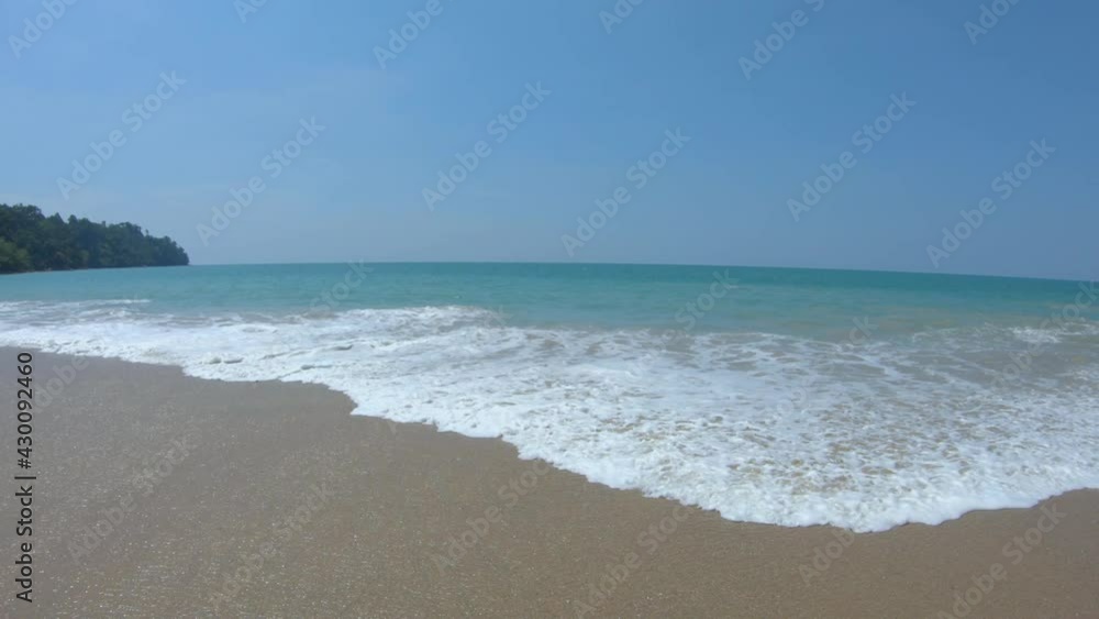 paning camera at the panoramic sea and beach view. white foming beautiful texture of waves at the hige tide time in the morning clear blue sky at the tropical beach. paning camera at the panoramic sea and beach view. white foming beautiful texture of waves at the hige tide time in the morning clear blue sky at the tropical beach.