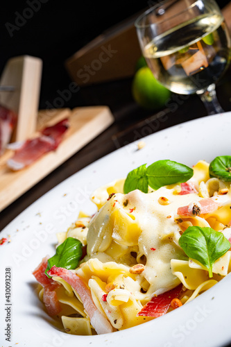 Tagliatelle with gorgonzola masarpone sauce and ham. photo