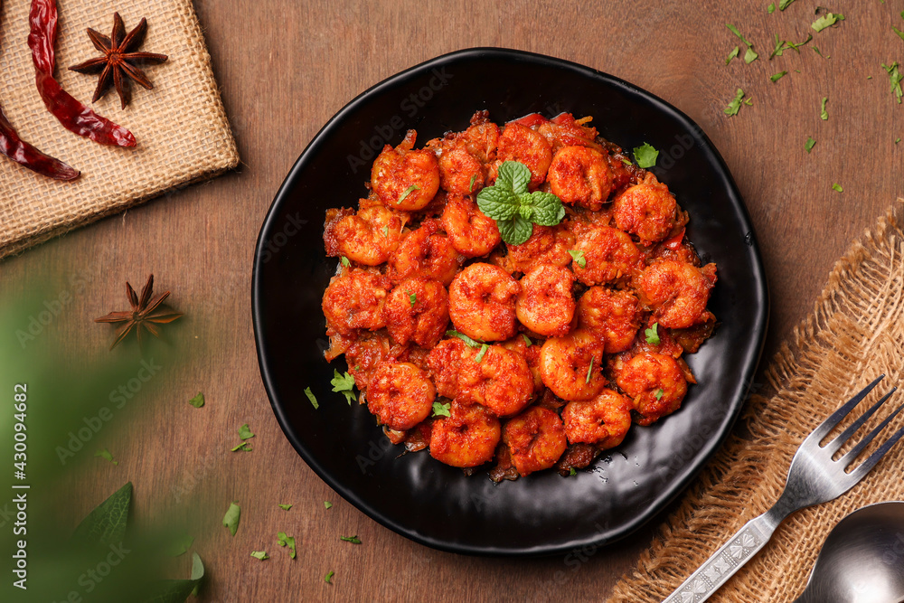 Top view spicy hot Bengali Prawn roast , shrimp masala fish curry