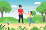 Family Playing Soccer In Park Together. Mother spending leisure summer time outdoors playing with children. Family summer time activity games with son.