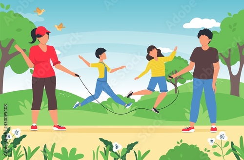 Family summer time activity games with children. Happy active kids jumping over skipping rope, held by parents. Family spending leisure summer time outdoors playing with children.