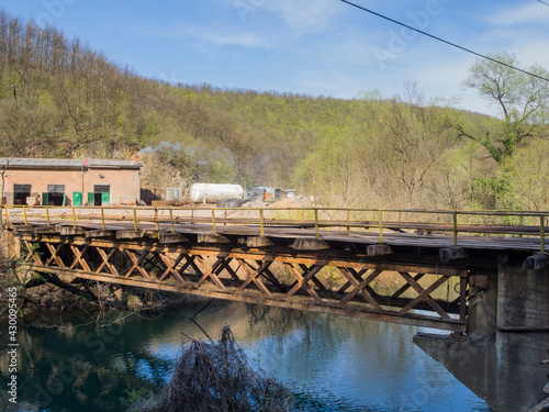Wallpaper Mural Old bridge over a river, the bridge is still in use, wagons drive over the bridge from the coal mine to the unloading station. Torontodigital.ca