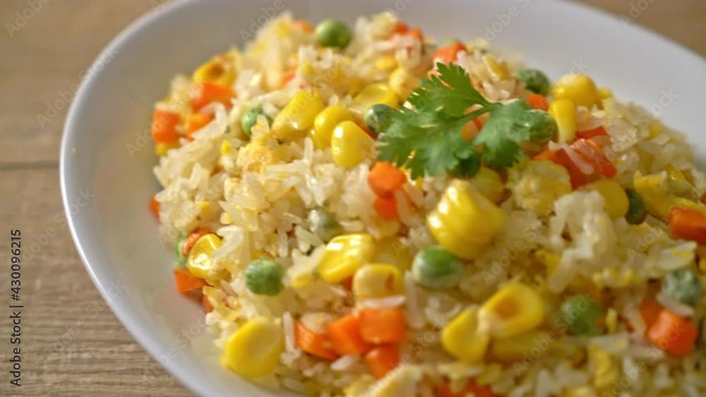 homemade fried rice with mixed vegetable (carrot, green bean peas, corn) and egg homemade fried rice with mixed vegetable (carrot, green bean peas, corn) and egg