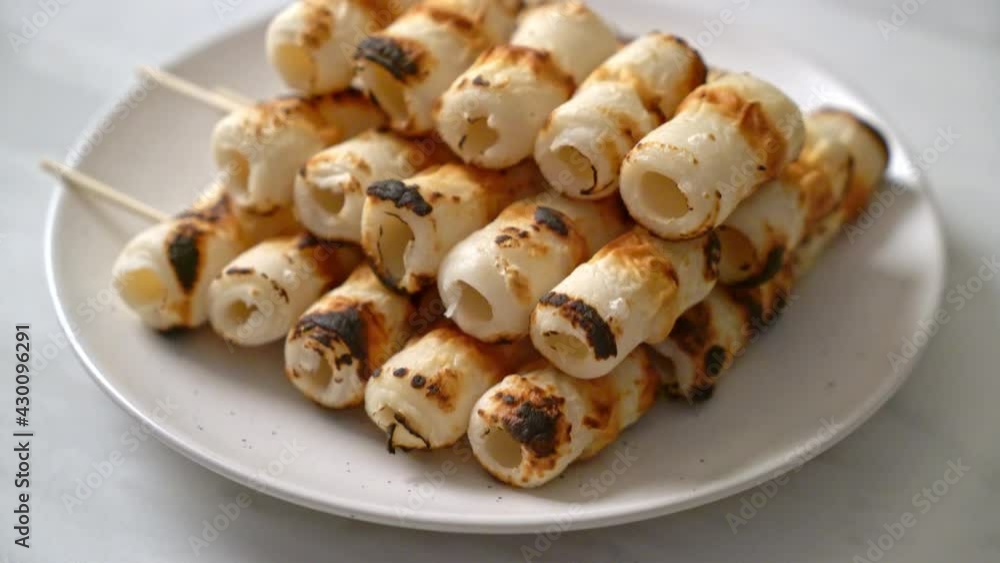 grilled tube shaped fish paste cake or tube squid skewer grilled tube shaped fish paste cake or tube squid skewer