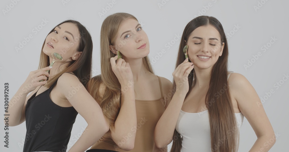 girls enjoy the process of massaging the skin with new beauty devices girls enjoy the process of massaging the skin with new beauty devices