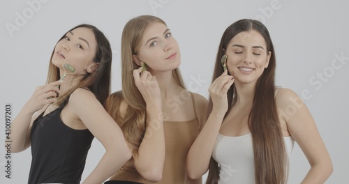 girls enjoy the process of massaging the skin with new beauty devices