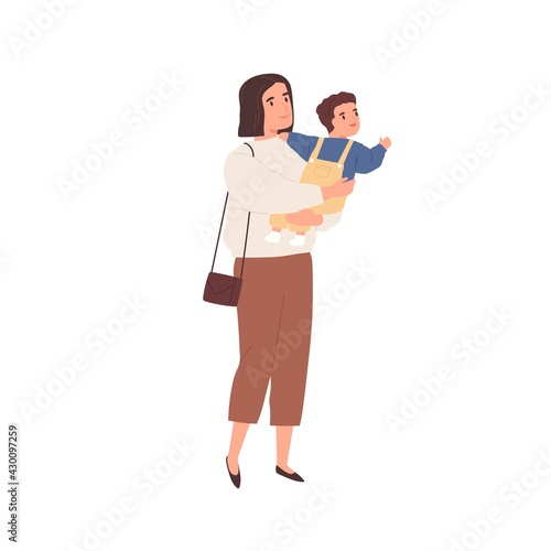 Young mother holding baby in hands and walking. Modern mom carrying little ch...