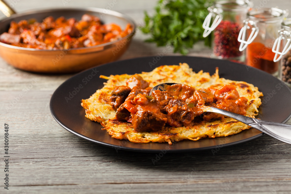 Hungarian potato pancake with goulash Hungarian potato pancake with goulash