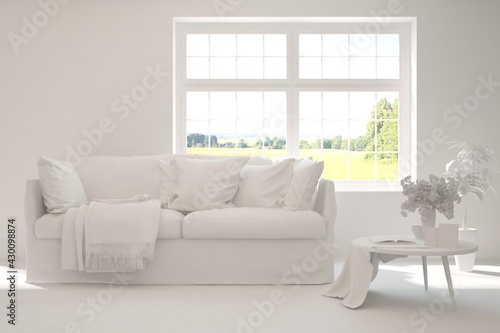 White living room with sofa and summer landscape in window. Scandinavian interior design. 3D illustration