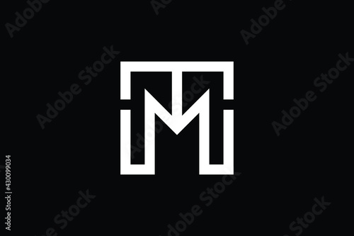 MT logo letter design on luxury background. TM logo monogram initials letter concept. MT icon logo design. TM elegant and Professional letter icon design on black background. M T TM MT