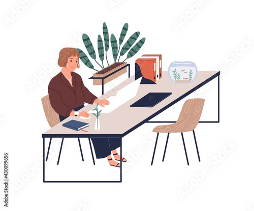 Happy young female worker working with laptop at desk in modern cozy office with plants and aquarium. Woman at comfortable workplace. Colored flat vector illustration isolated on white background