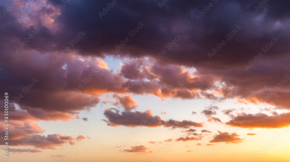 Colorful cloudy sky at sunset. Sky texture, nature background.