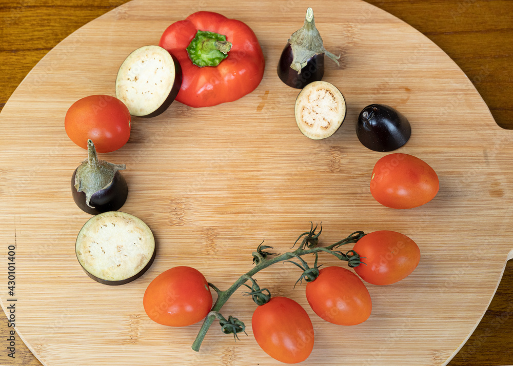 circle of vegetables on a wooden board, background of vegetables circle of vegetables on a wooden board, background of vegetables