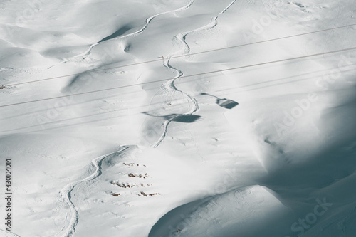 Ski lift shadow on the snow