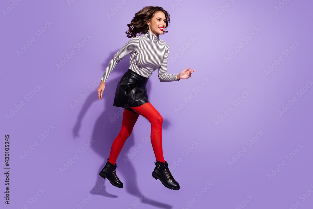Full body profile side photo of young girl happy smile go walk run jump hurry sale isolated over violet color background