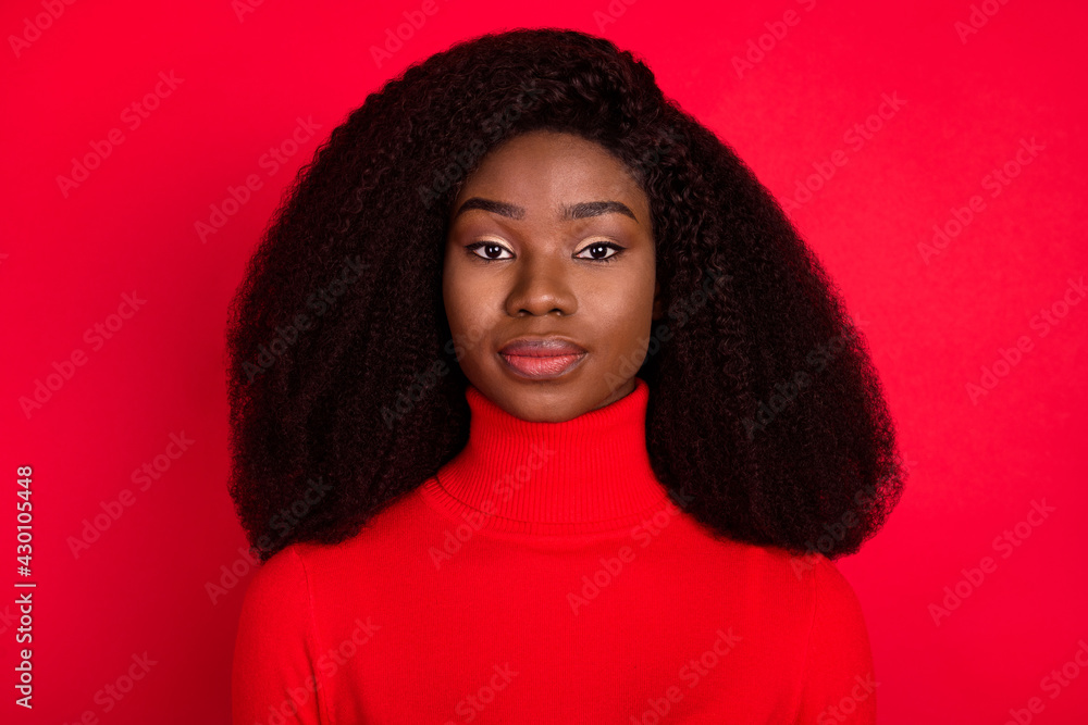 Photo of young attractive african woman serious confident wear turtleneck isolated over red color background Photo of young attractive african woman serious confident wear turtleneck isolated over red color background
