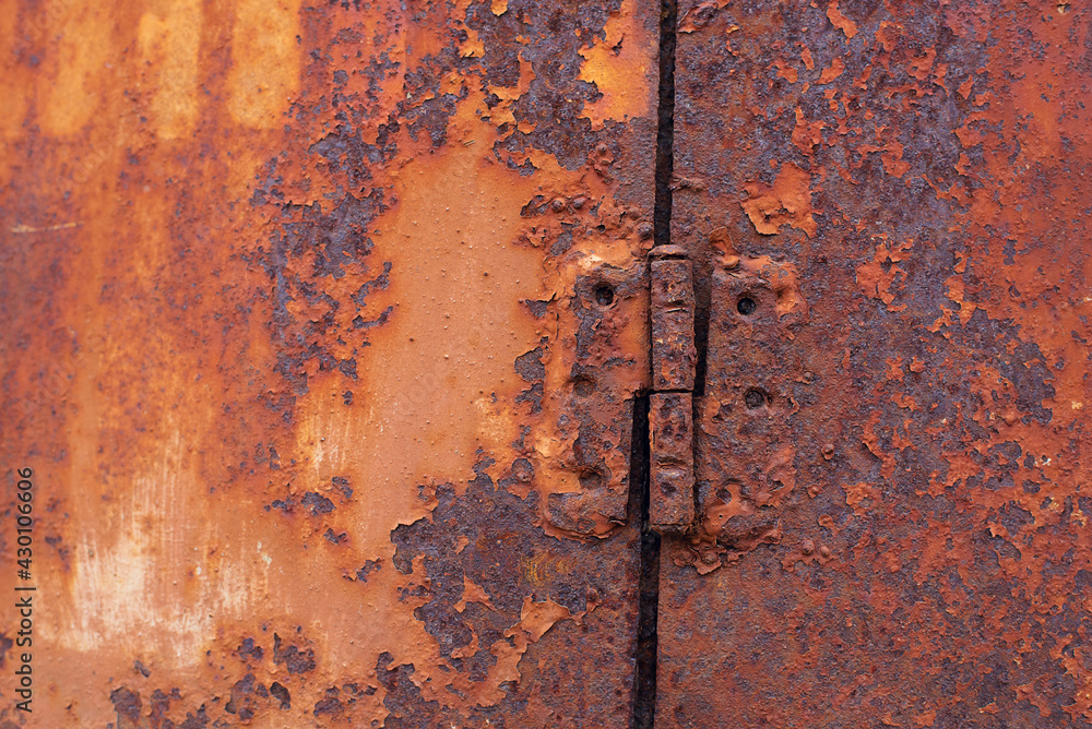 Rusty metal door hinge closeup