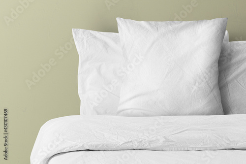 Foto Pillow on bed with blank copy space