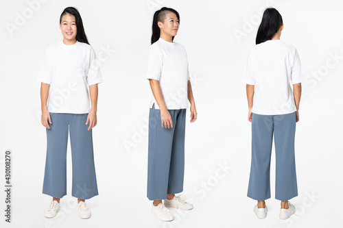 Woman in white tee and blue loose pants minimal fashion