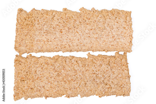 Top view of two flat rye-wheat crispbreads, close-up