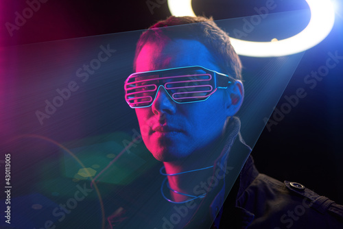 Cyberpunk style portrait of man in futuristic costume.