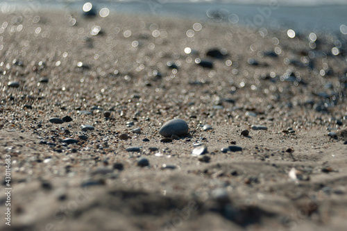 Tracing stones on the beach near the sea