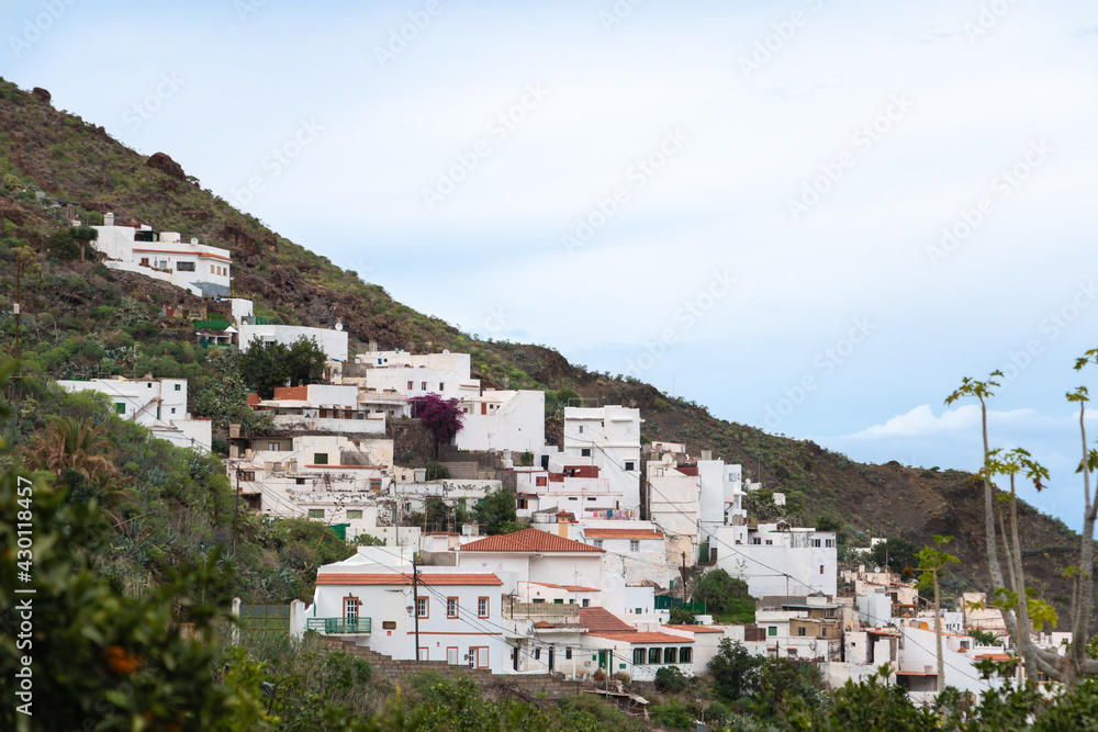 White houses of the town of Agaete on the mountainside on the island of Gran Canaria, Spain