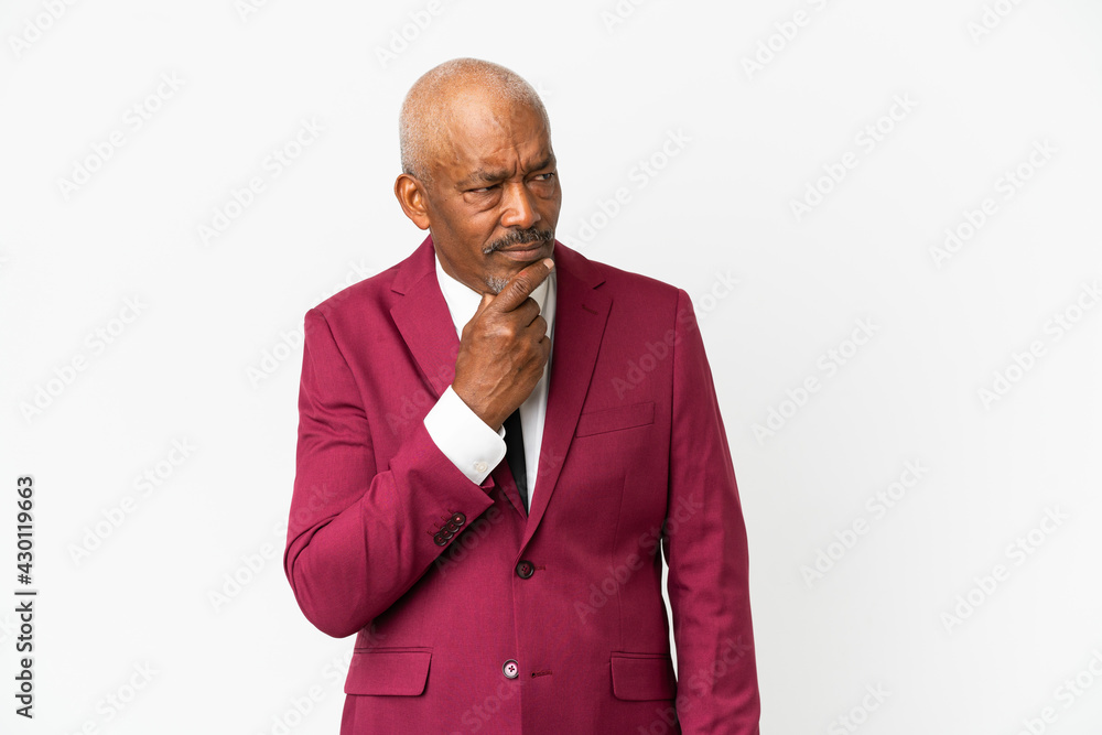 Cuban senior isolated on white background having doubts Cuban senior isolated on white background having doubts