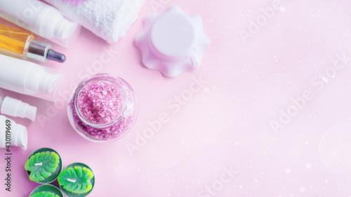 Lavender sea salt with natural spa products and on a pink background. copy space. Banner