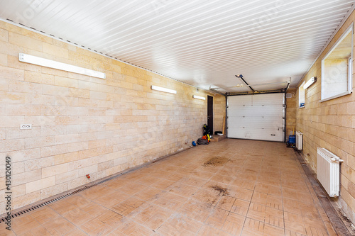large car garage with sectional doors