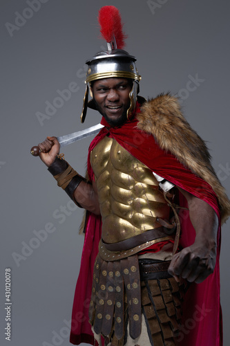 Offensive roman soldier of african ethnic with gladius