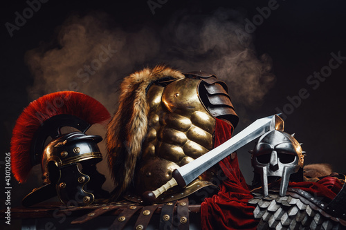 Golden armor between gladiator and legionary helmets Fototapet