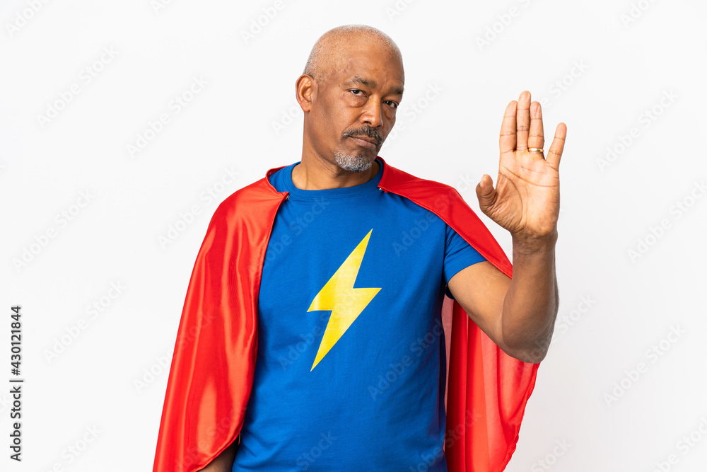 Super Hero senior man isolated on white background making stop gesture and disappointed Super Hero senior man isolated on white background making stop gesture and disappointed