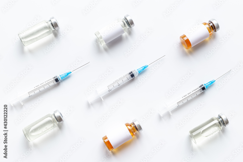 Vaccination with Covid vaccine in bottles with syringe Vaccination with Covid vaccine in bottles with syringe