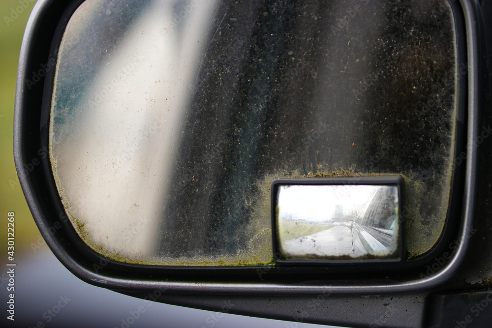 veiw through a grimy old car mirror veiw through a grimy old car mirror