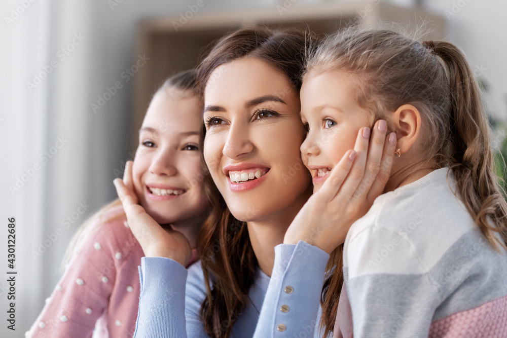 people, family and love concept - happy smiling mother with two daughters at home