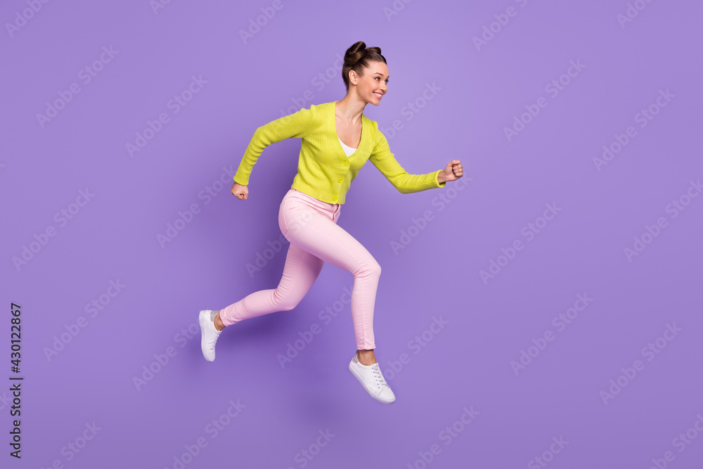Full length body size photo of woman with girlish hairstyle jumping running fast on sale isolated on pastel violet color background