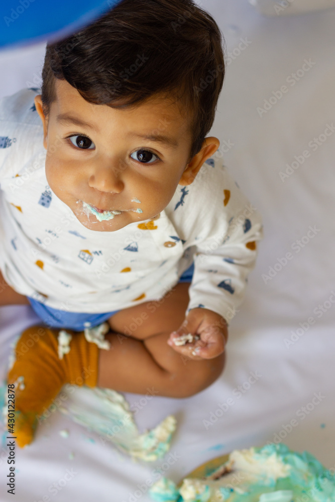 Curious baby eating his first birthday cake Curious baby eating his first birthday cake