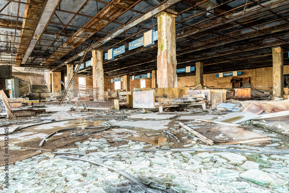 Prypyat, Kiev region, Ukraine - April 13, 2019:old ruins of an abandoned and looted supermarket in the basement of a devastated house in the city of Pripyat in the Chernobyl nuclear disaster zone Prypyat, Kiev region, Ukraine - April 13, 2019:old ruins of an abandoned and looted supermarket in the basement of a devastated house in the city of Pripyat in the Chernobyl nuclear disaster zone