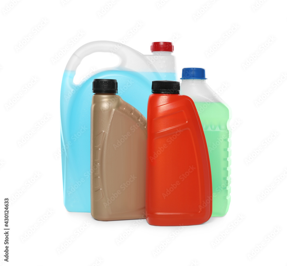 Antifreeze in plastic bottles isolated on white Antifreeze in plastic bottles isolated on white