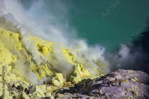 Aerial view of Kawah Ijen acid lake and sulfur mines from the top of volcano. The Ijen volcano complex is a group of composite volcanoes in the Banyuwangi Regency of East Java, Indonesia.