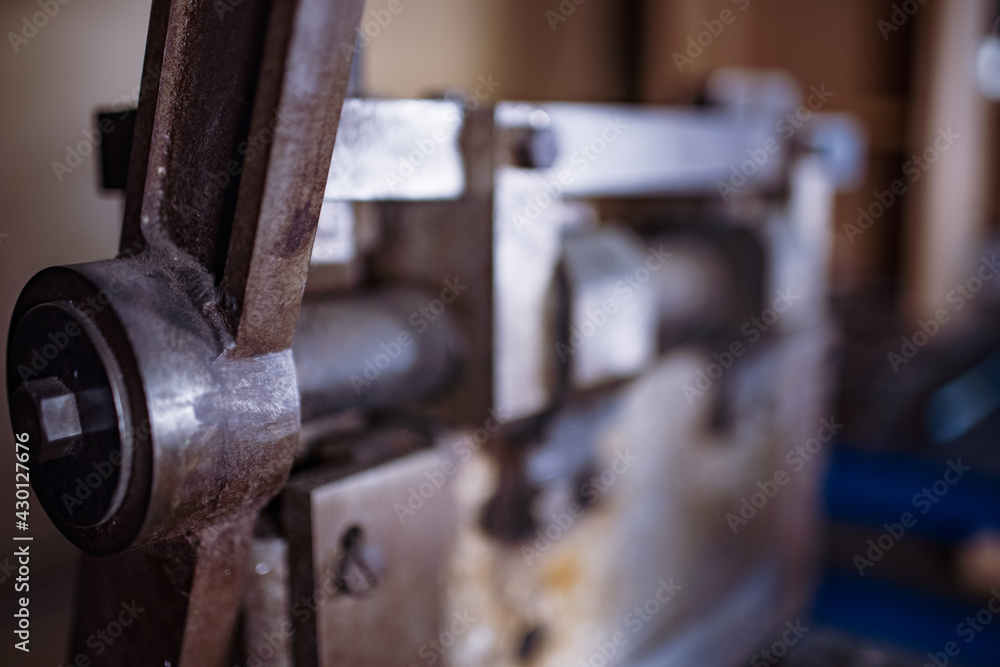 Guillotine machine close-up rusty metal massive parts