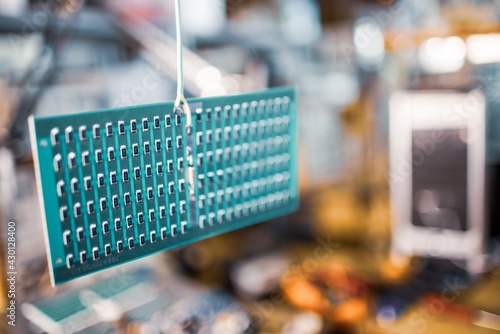 Close-up side view of a panel of SMD resistors