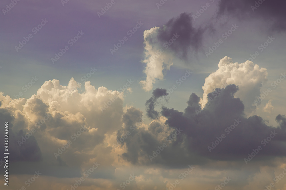 The cloudy beautiful sky with the light shining from the sun at afternoon. The softness of the cloud creates a feeling of relaxation. copy space, No focus, specifically.