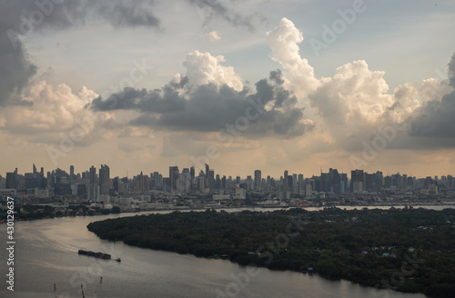 Fototapeta Naklejka Na Ścianę i Meble -  Bangkok, Thailand - Apr 16, 2021 : Beautiful sky and cloud view of Bangkok with skyscrapers along Chaopraya river in the afternoon. Selective focus.