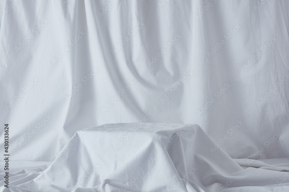 Still life photography product background on white linen sheet